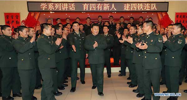 Xi urges continued efforts to build strong military