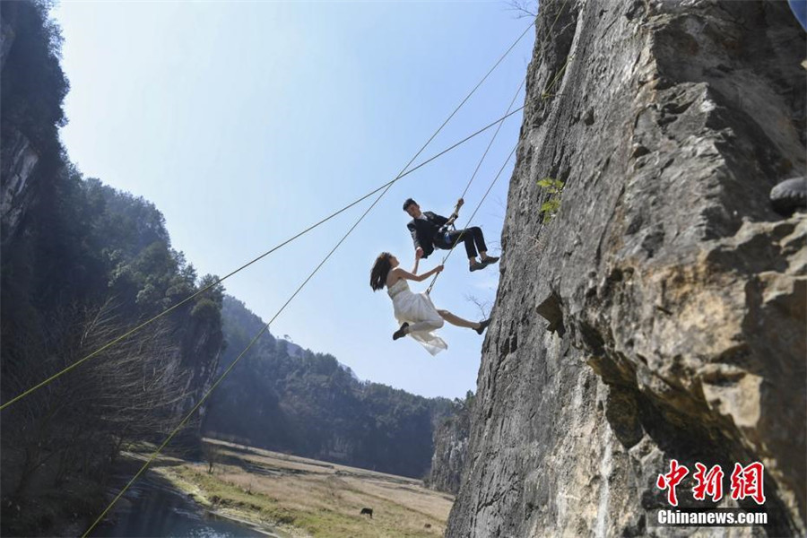 Taking love to new heights with special cliffside wedding photo