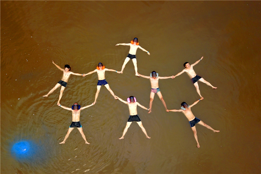 Swimmers float in 'Dead Sea' in Dalian