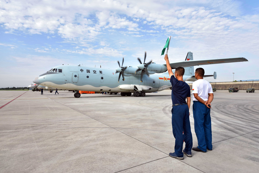 Military plane carries out aerial photography over the quake-hit region