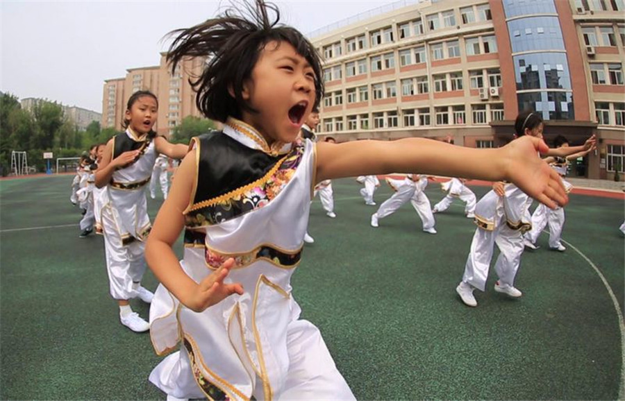 Students practice martial arts during class break