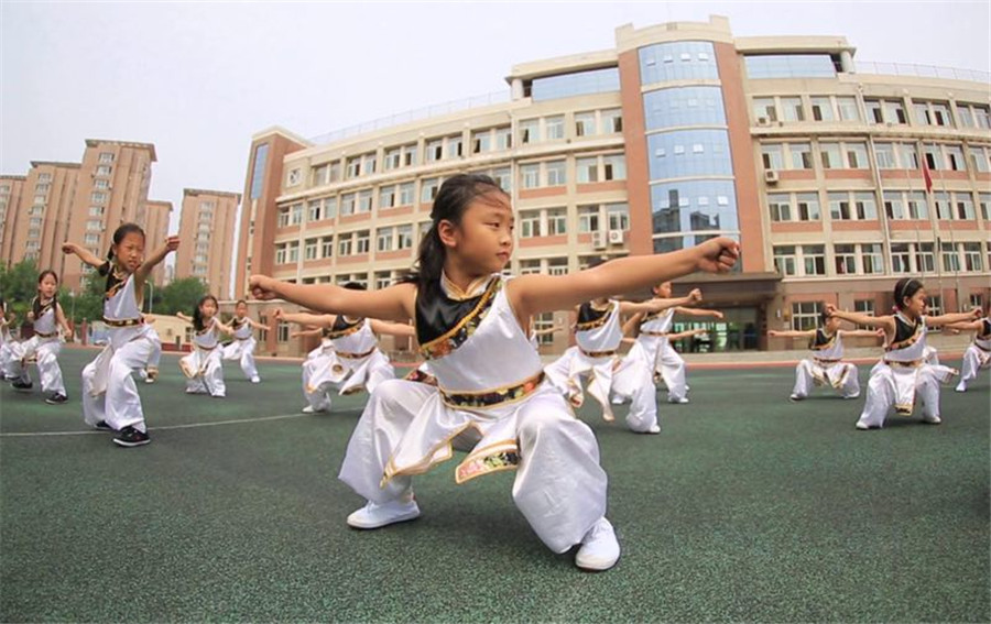 Students practice martial arts during class break