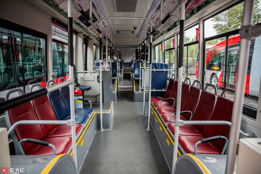 10 electric 'Chinese red' buses hit the roads in central Beijing