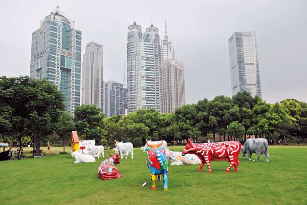 Divine decorated bovines at Shanghai Cow Parade