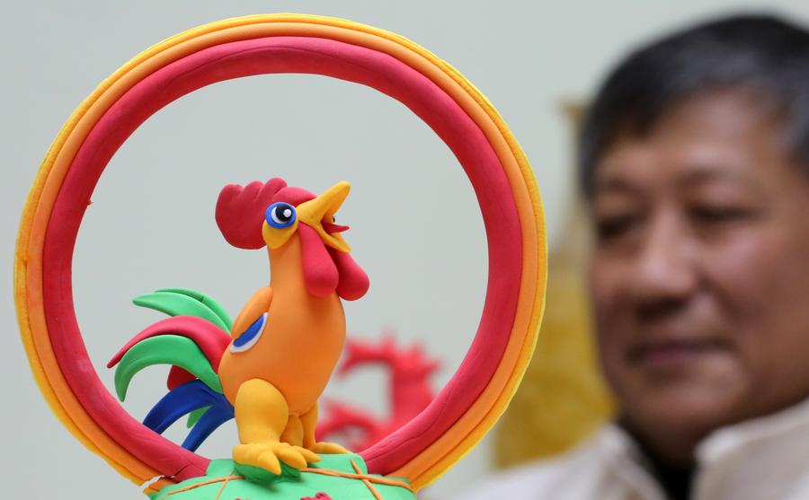 Rooster-shaped dough modellings made to greet Chinese lunar new year