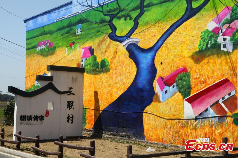 Giant 3D paintings draw visitors to remote village