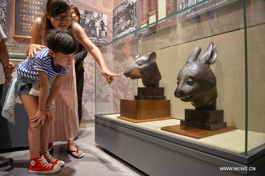 Rat, rabbit head sculptures on display