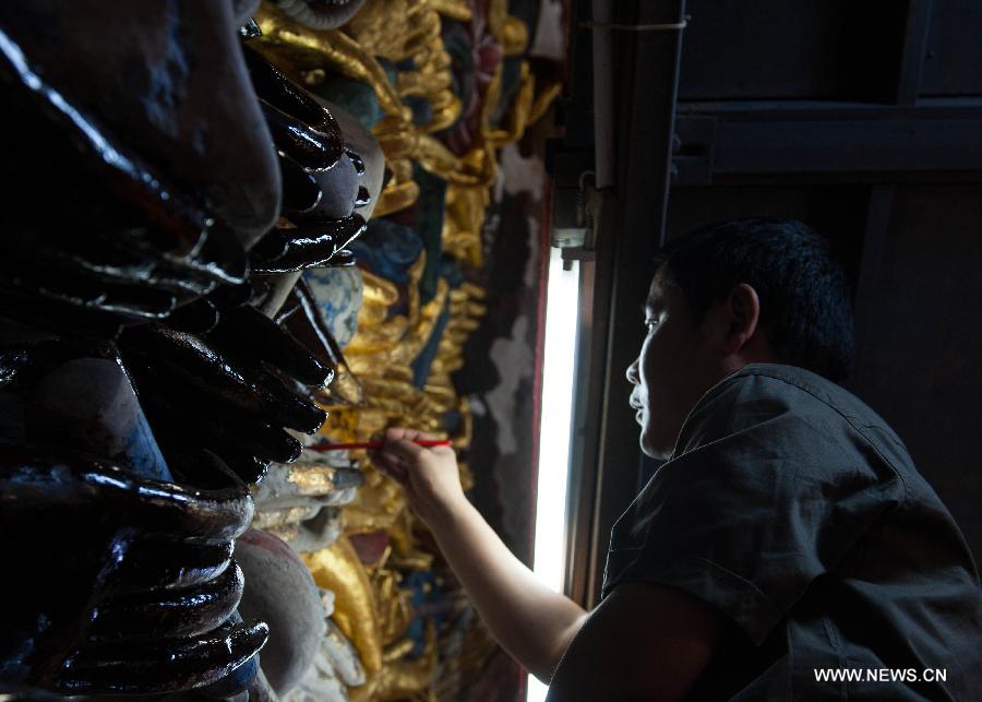 Restoration for sculpture of Qianshou Guanyin underway in Chongqing