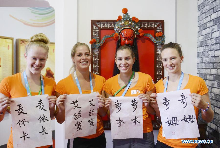 Athletes practice calligraphy at Youth Olympic Village