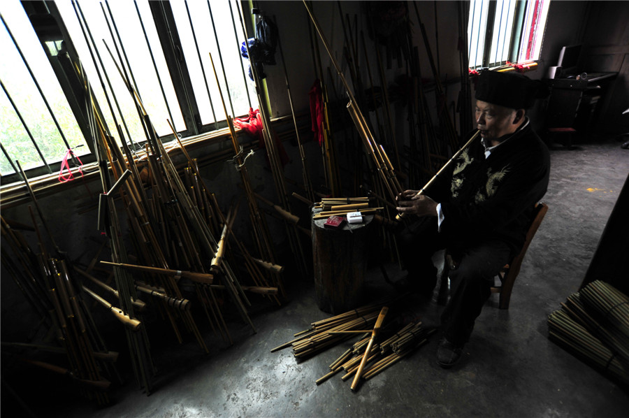 Inheritor of reed-pipe wind instrument 'Lusheng' in Guizhou