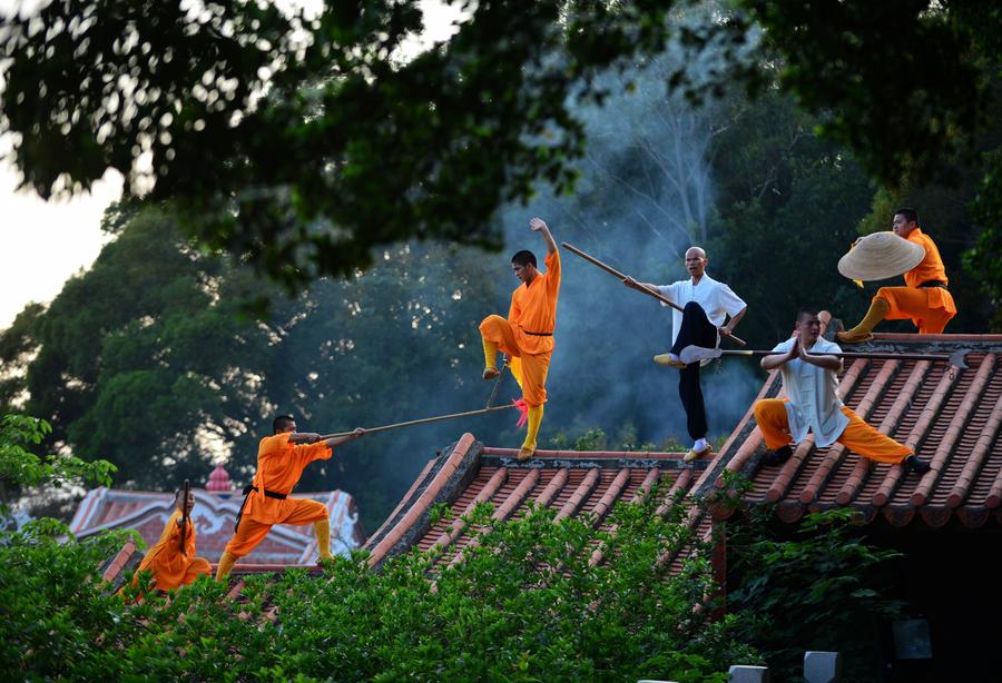 Monks practice martial art at Quanzhou Shaolin Temple