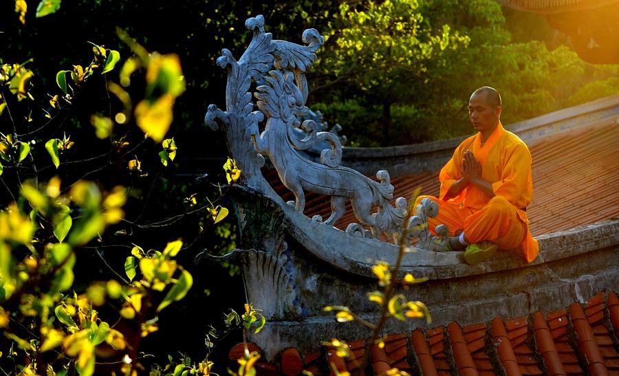 Monks practice martial art at Quanzhou Shaolin Temple