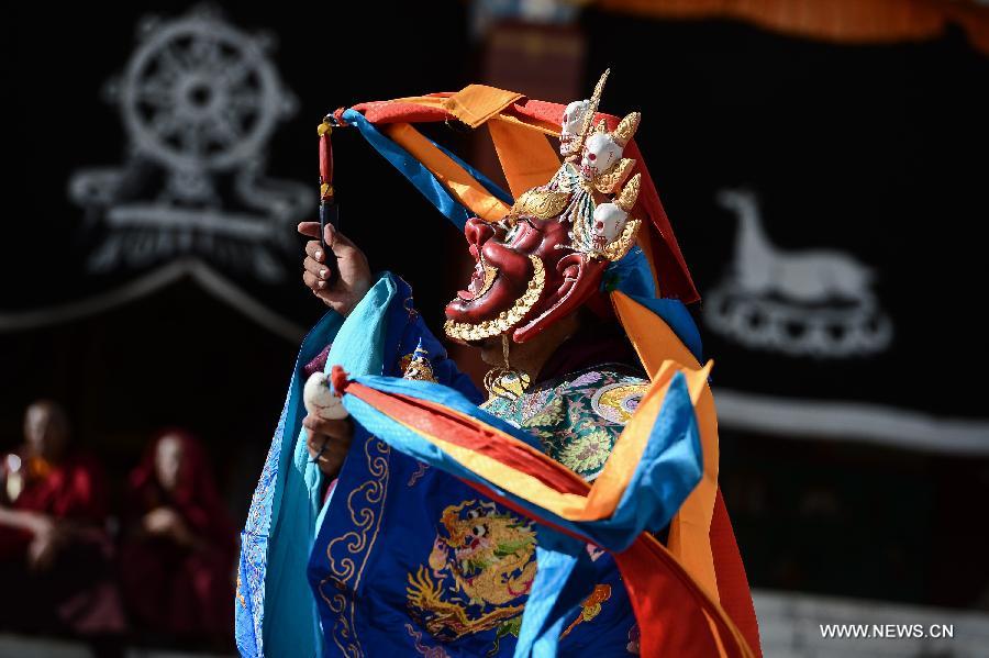 Monks wearing masks rehearse Gesar opera at Chalang Temple in NW China