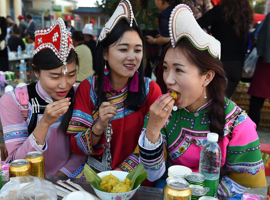 Locals enjoy themselves during traditional festival in Yunnan