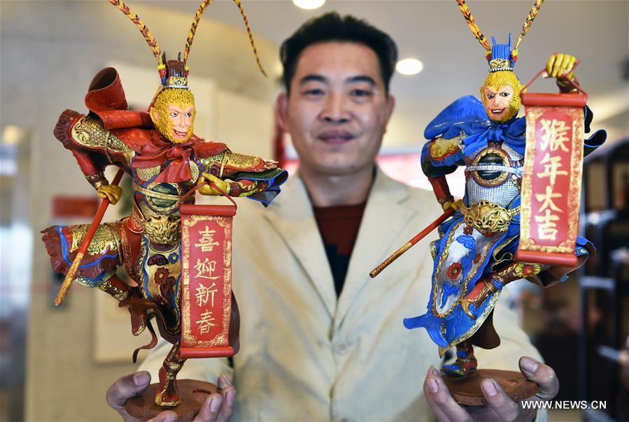 Folk artist makes sculptures of Monkey King to greet Chinese Lunar New Year