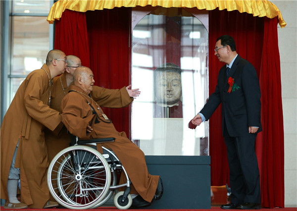 Ceremony held to unveil returned Buddha head in Beijing