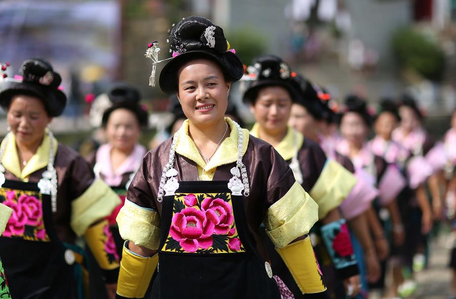 Miao people dance to celebrate 'Chixin Festival' in SW China's Guizhou