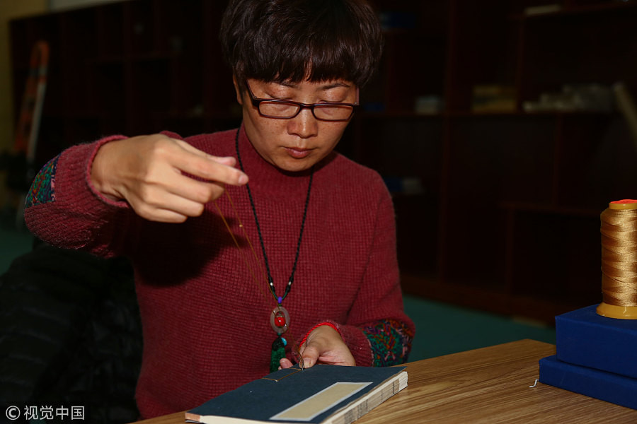 Restorer revives thousands of ancient books