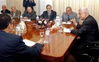 In this photo released by the Palestinian Authority, Palestinian Authority President Mahmoud Abbas, also known as Abu Mazen, right, meets with representatives of Palestinian factions in Gaza City, Saturday, Jan. 22, 2005. Abbas who had said he wants to avoid force, and is instead trying to reach agreement with the militants, had been meeting in the past few days with militant leaders in Gaza, and participants have reported progress toward a truce deal that could halt attacks on Israelis. [AP]