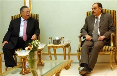 Iraq President Jalal Talabani, left, meets with Saleh al-Motlaq, a Sunni member of the constitution drafting committee and a group of Sunni Arab leaders on Thursday August 25, 2005 in the heavily fortified Green Zone area in Baghdad, Iraq. President Talabani said he is optimistic that consensus will be achieved regarding Iraqs new constitution. [AP]