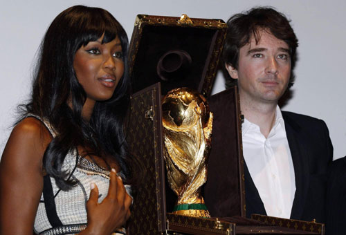 Naomi Campbell poses with World Cup trophy presented in LV travelling case