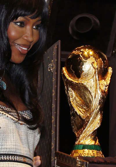 Naomi Campbell poses with World Cup trophy presented in LV travelling case