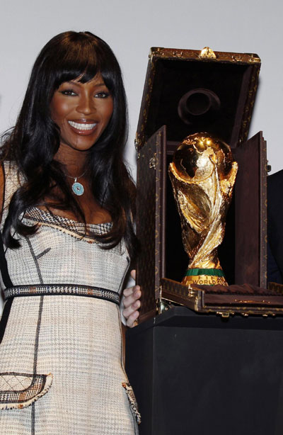 Naomi Campbell poses with World Cup trophy presented in LV travelling case