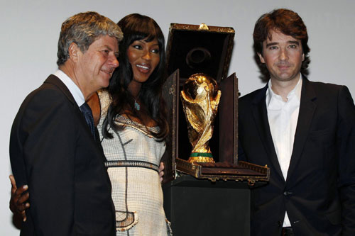 Naomi Campbell poses with World Cup trophy presented in LV travelling case