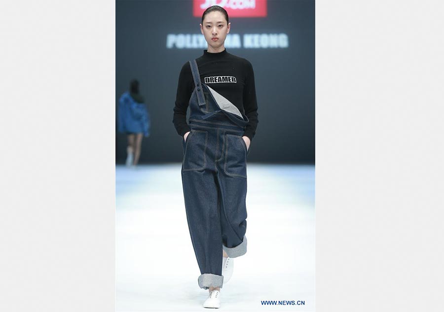 Models present creations of Jiang Yueyin at China Fashion Week