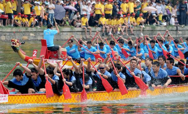 Participants compete in dragon boat races before Dragon Boat Festival