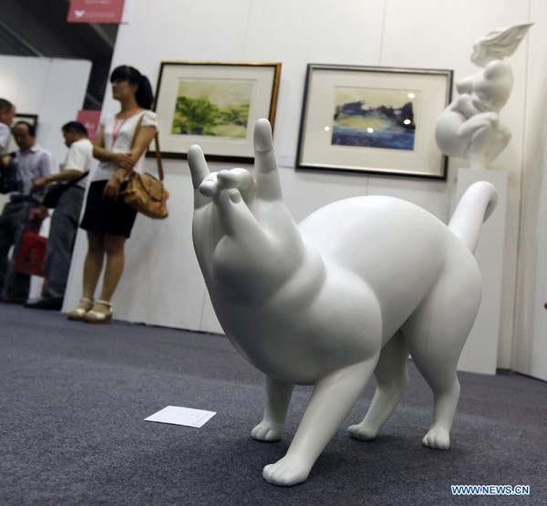 Creative statues displayed at Beijing Art Expo