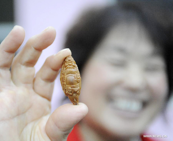 Walnut sculpture village in N China