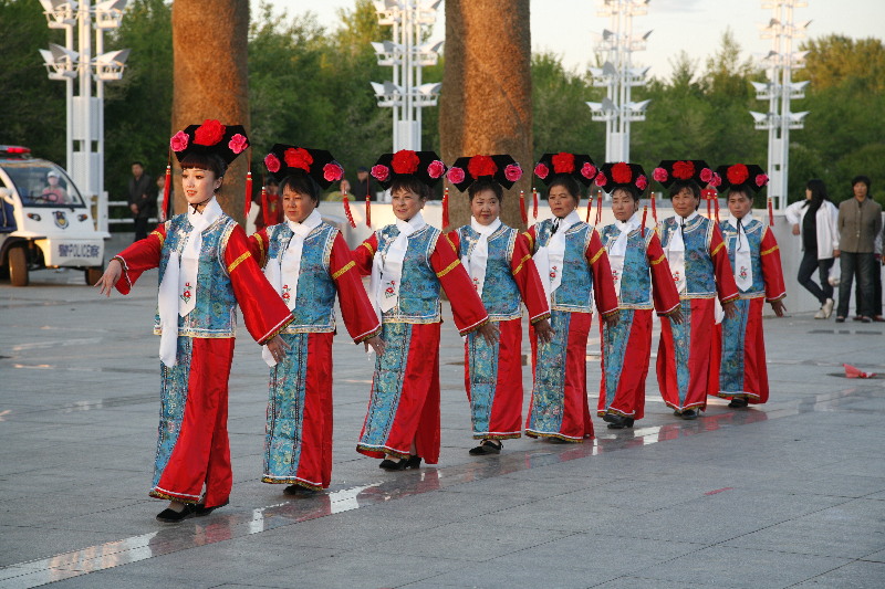 Folk artists perform in traditional costumes of Qing Dynasty