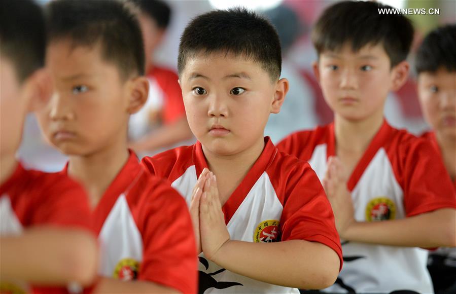 Children learn martial arts at training center in Henan province