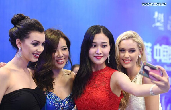 Finalists of Miss World take selfies in SE China