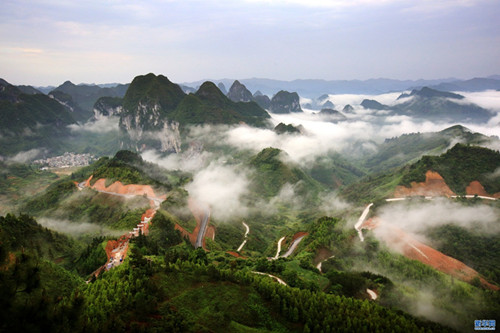 Mountains submerged in fog