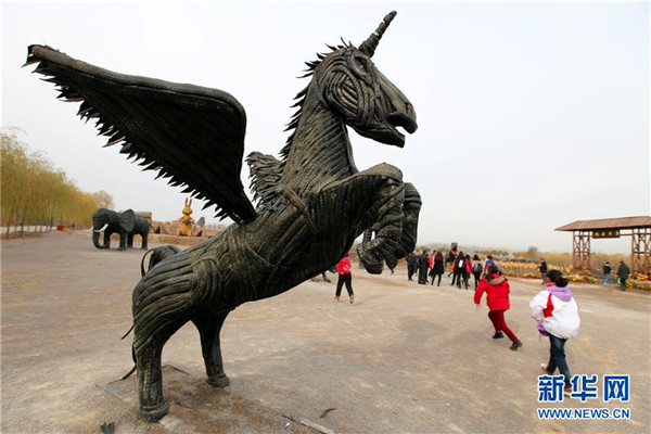 Shandong farmers make cartoon characters out of used tires