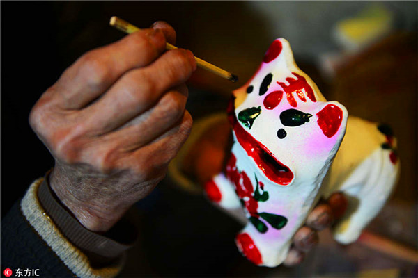 70-year-old villager devoted to painted clay sculpture