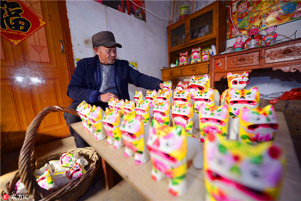 70-year-old villager devoted to painted clay sculpture