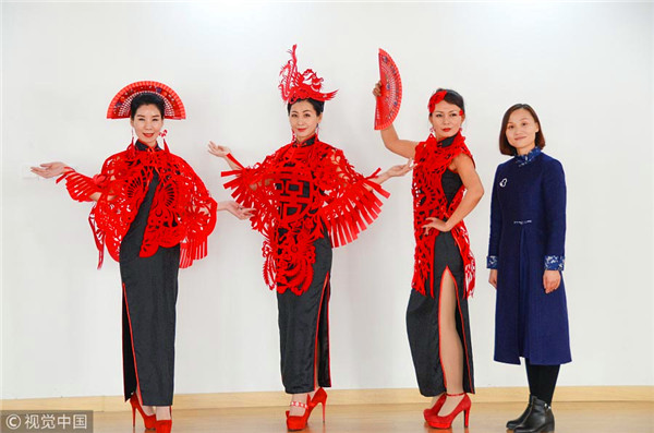 Traditional paper-cutting adds festive touch to qipao