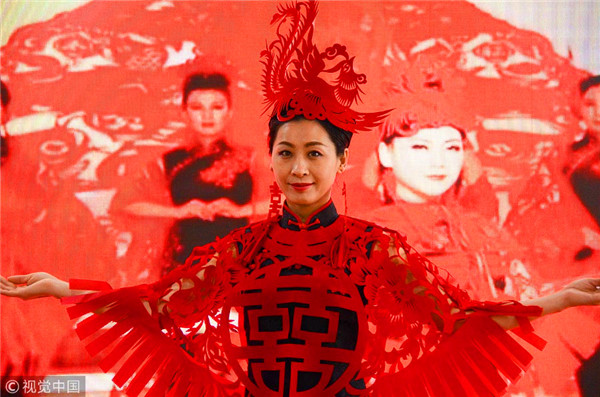 Traditional paper-cutting adds festive touch to qipao