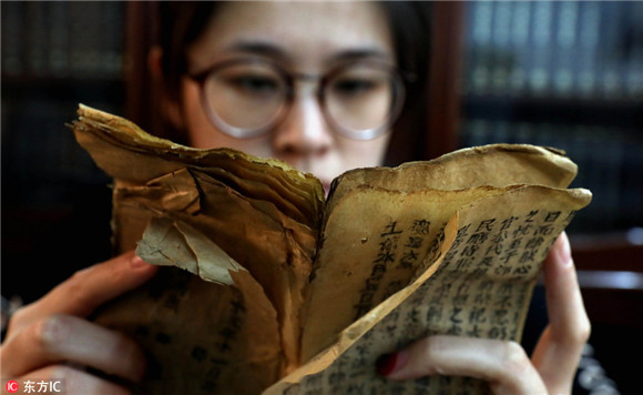 Young but skillful hands restore 300 old books