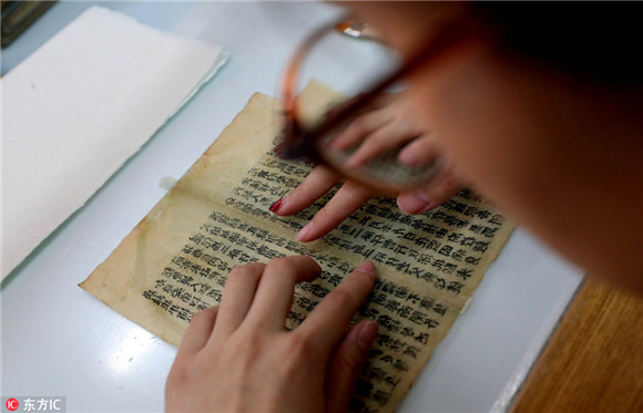 Young but skillful hands restore 300 old books