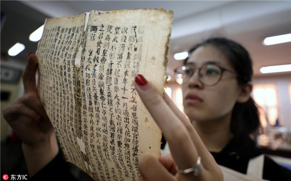 Young but skillful hands restore 300 old books