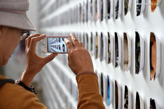 People visit photo exhibition at Pingyao Int'l Photography Festival