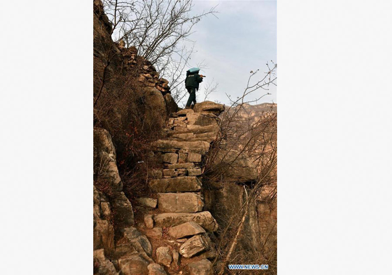 60-year-old postman working in mountainous area for 30 years