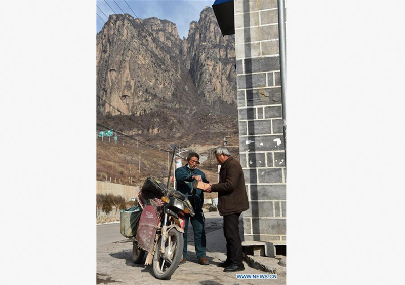 60-year-old postman working in mountainous area for 30 years