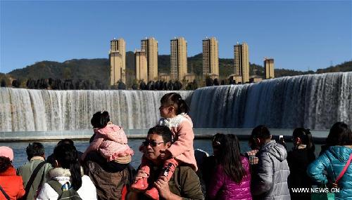 Park featuring 400m-wide manmade waterfall opens in Kunming