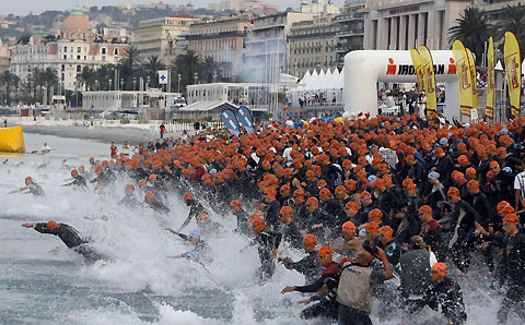 Competitors participating in the Ironman Triathlon start the swimming leg in Nice, southeastern France, June 25, 2006. Competitors will swim 3.8 km (2.4 miles), then cycle 180 km (110 miles), before finishing with a 42.195 km (26 miles) run.