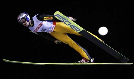 Poland's Adam Malysz soars through the air during the trial jump of the normal hill HS 100 ski jumping competition at the Nordic World Ski Championships in Sapporo, northern Japan March 2, 2007. 